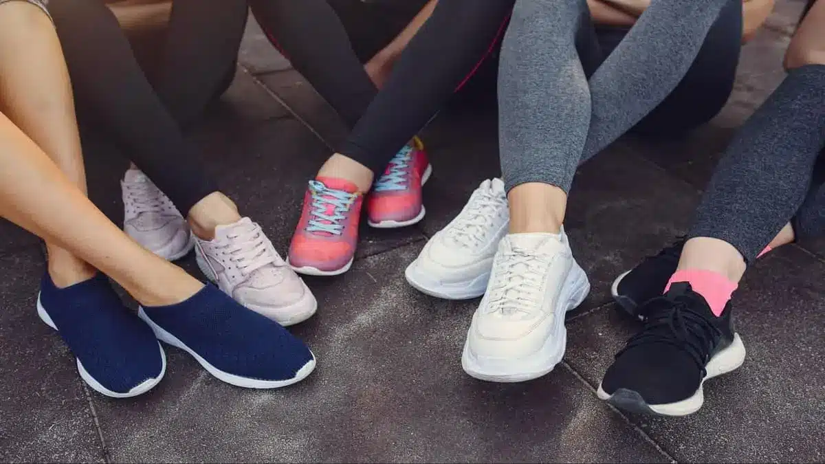 Differences Between Shoes and Sneakers. the picture shows friends wearing different colors of shoes
