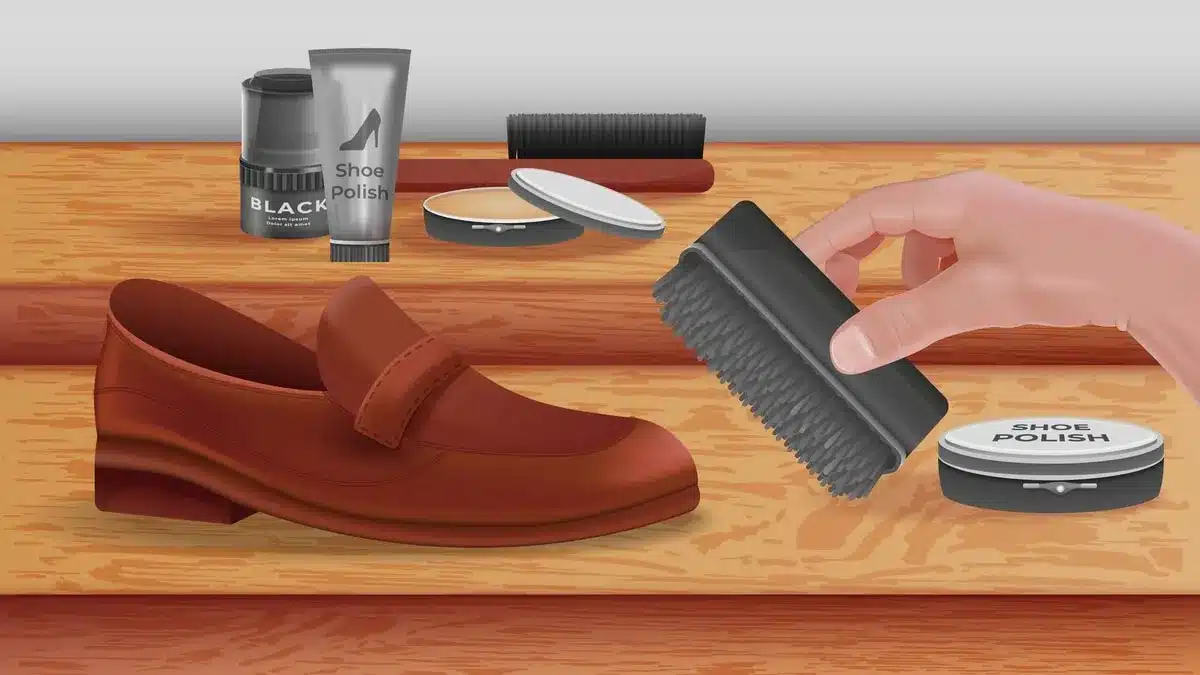How to Clean Used Shoes. A person cleaning brown shoe with shoe brush