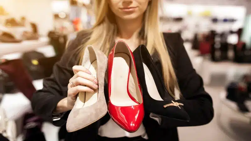 The Best Shoes for Female bartenders, a girl holding different colors of shoes
